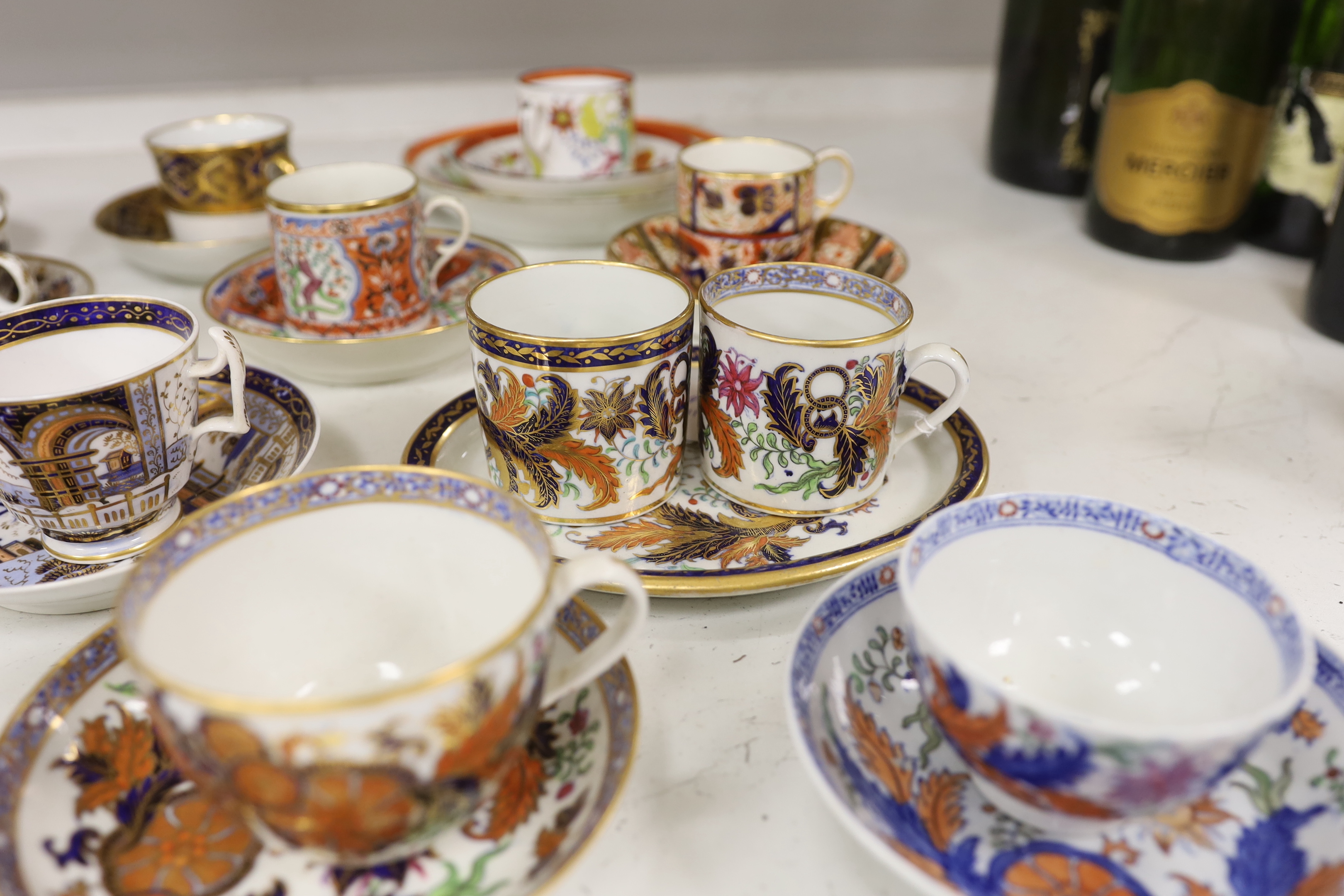 Six mixed English 1800-1820 porcelain cabinet cups and saucers, three similar coffee cans and saucers, a matching spoon stand and two coffee cans, a saucer dish, coffee can plus saucer and a tea bowl and matching saucer